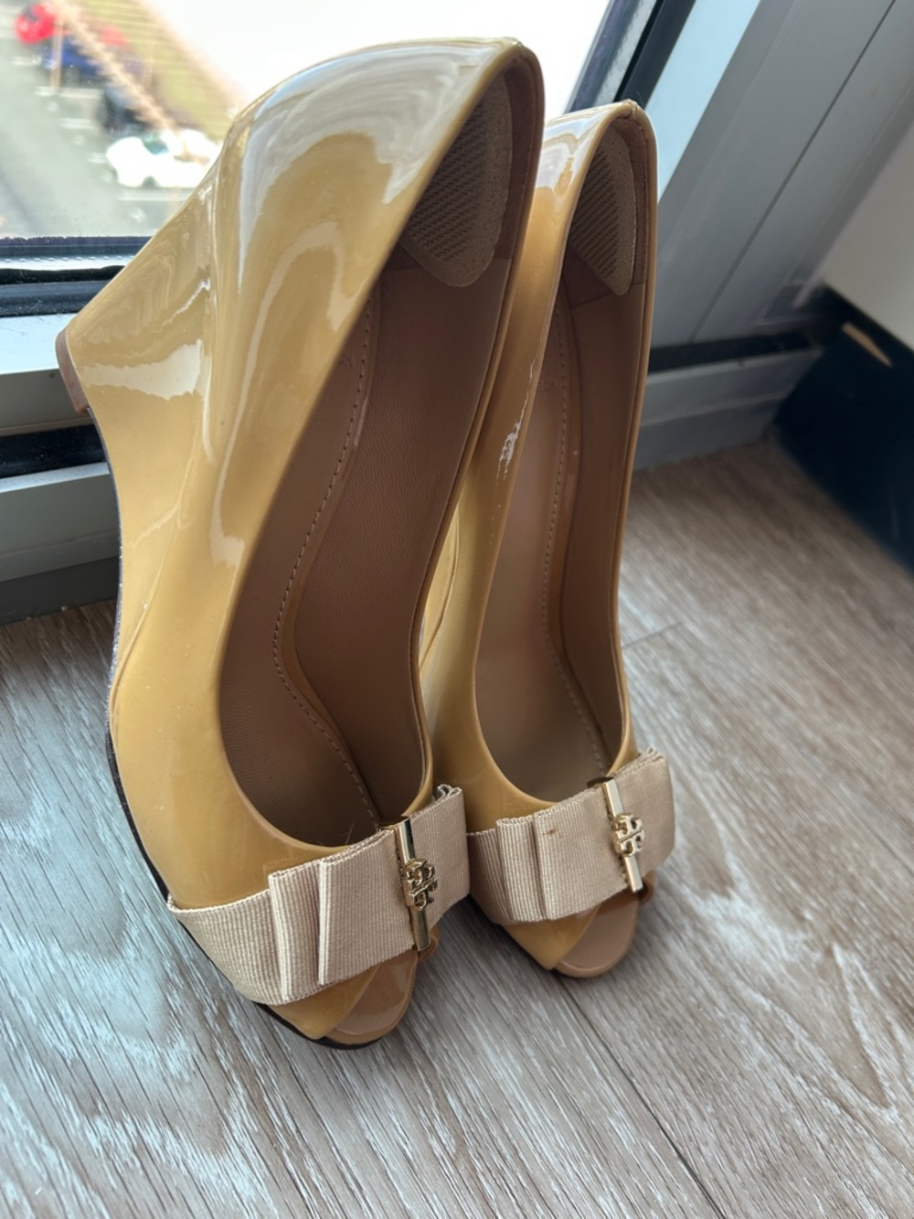 Bow-Accent Patent Peep-Toe Wedge Heels in Mustard